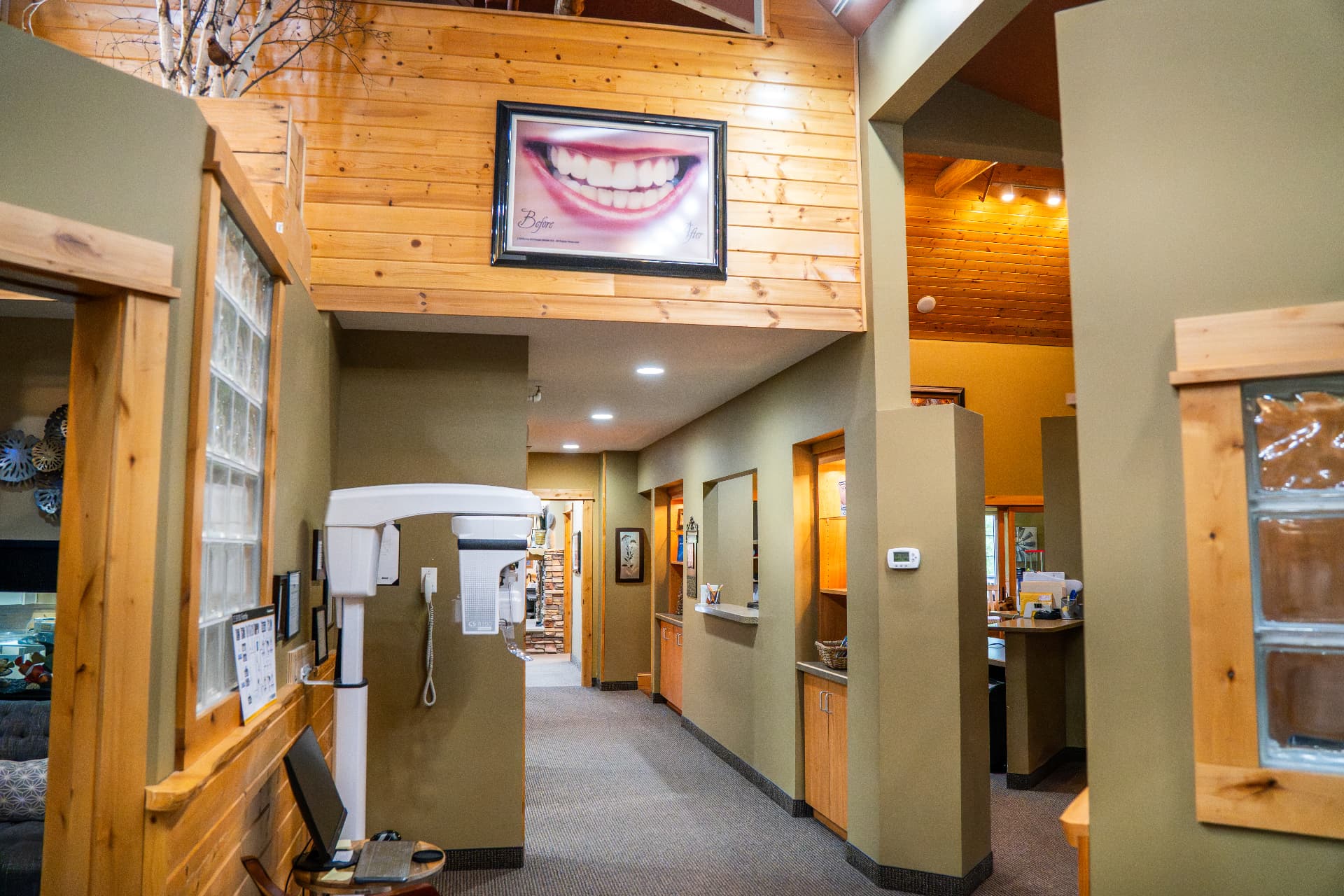 12. The corridor past the front desk, running back toward the treatment rooms.