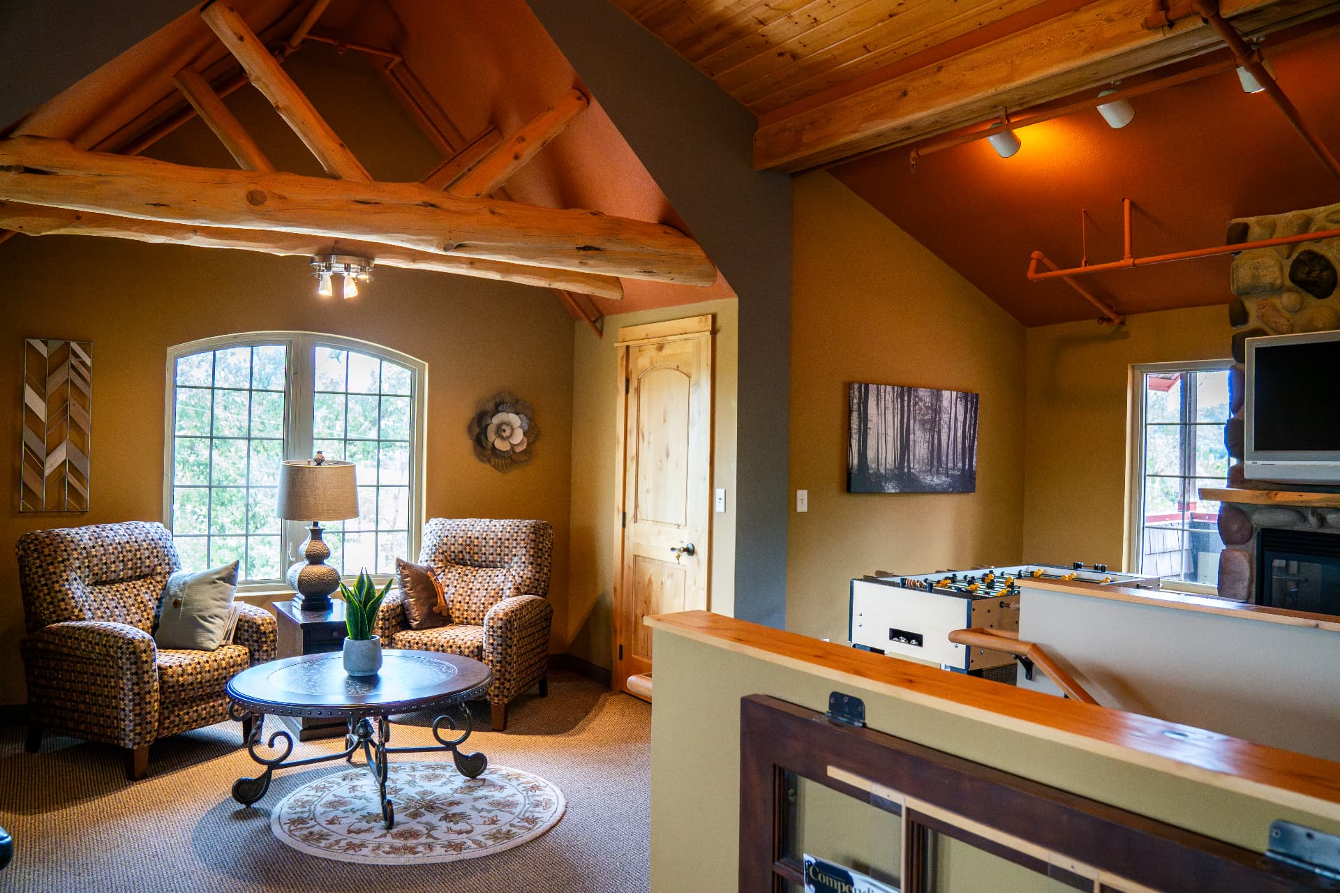 19. Up top: the attic lounge under the log trusses.
